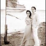 Bride and Groom on Beach with Flag