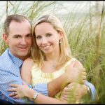 Engaged couple in beach grass