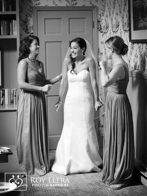 Bridesmaids at New York Wedding helping an excited bride